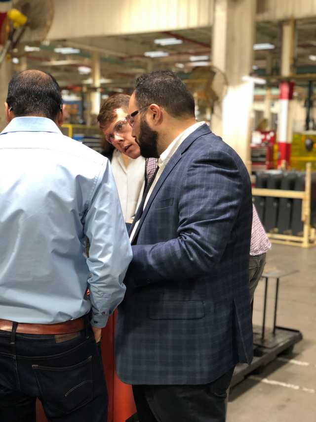 Rami and a group of developers on the Toyota factory floor