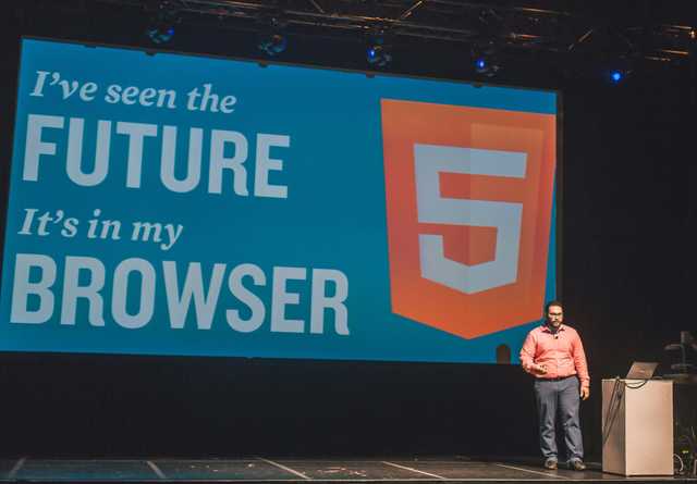 Rami Sayar presenting at JavaScript Open Days in 2015 with the text "I've seen the Future. It's in my browser" in large block font behind him